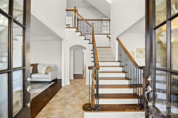 a view of entryway with furniture and stairs