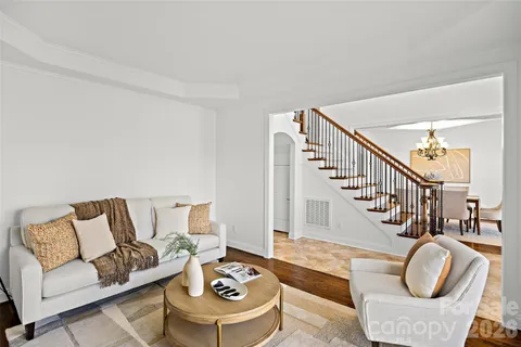 a living room with furniture and a table