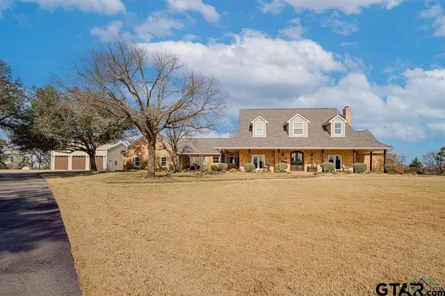 a large building with a large tree in front of it