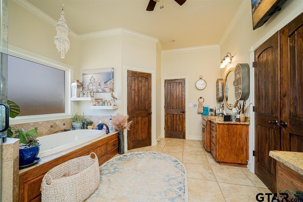 19980 FM 449 Longview, TX 75605 - Photo 19 of 48 a spacious bathroom with a tub sink and mirror