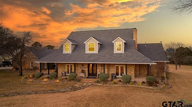 a front view of a house with yard and seating area