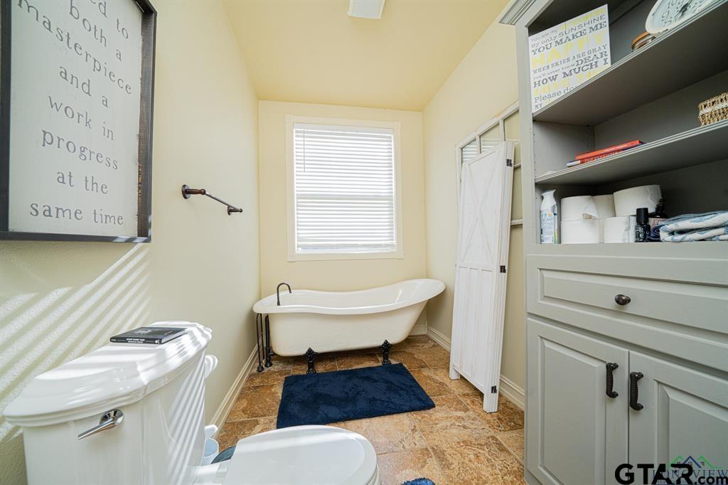19980 FM 449 Longview, TX 75605 - Photo 23 of 48 a bathroom with a sink toilet and shower
