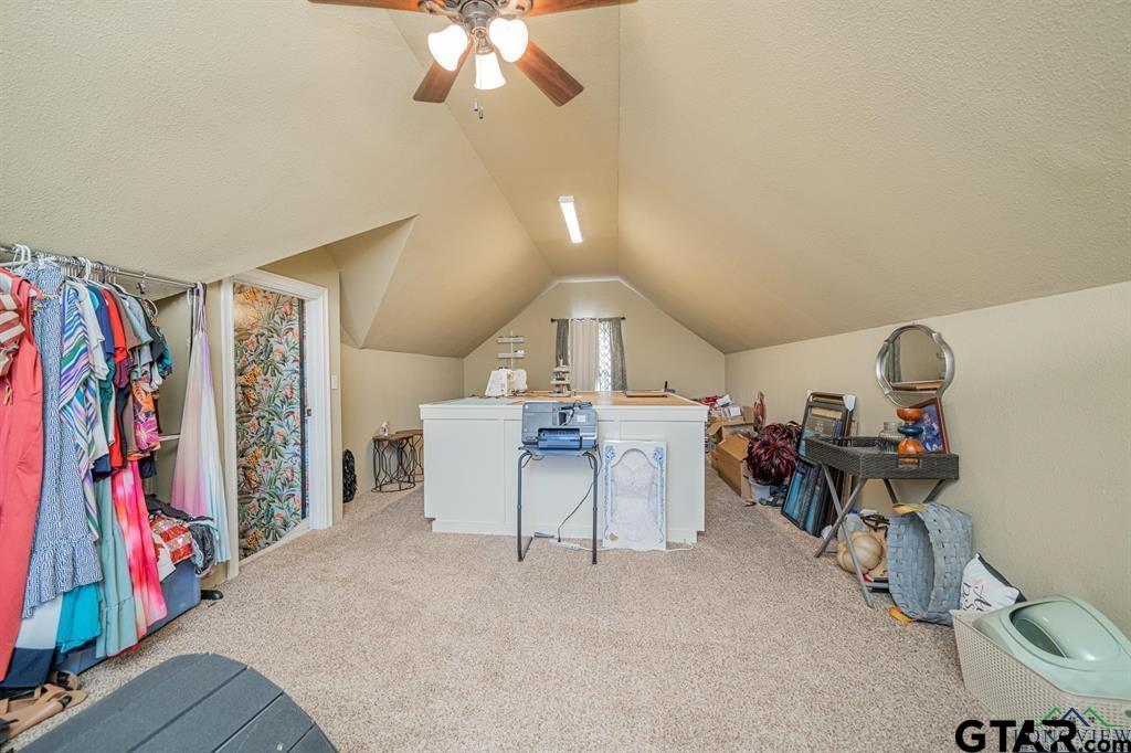 19980 FM 449 Longview, TX 75605 - Photo 24 of 48 a view of a livingroom with furniture and a fan
