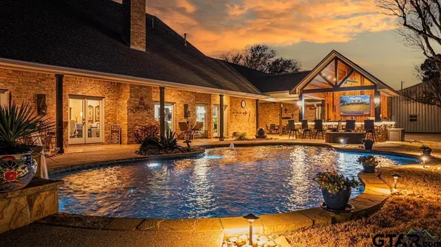 a view of a house with swimming pool