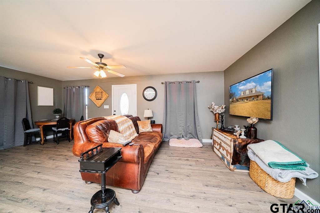 19980 FM 449 Longview, TX 75605 - Photo 32 of 48 a living room with furniture and wooden floor