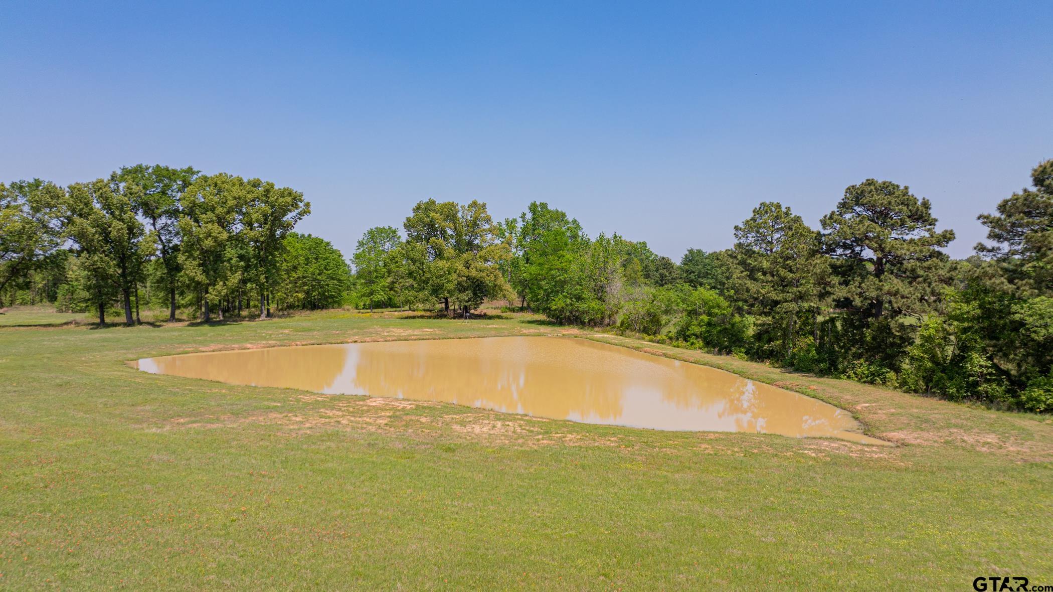 19980 FM 449 Longview, TX 75605 - Photo 45 of 48 a view of a swimming pool and an outdoor space
