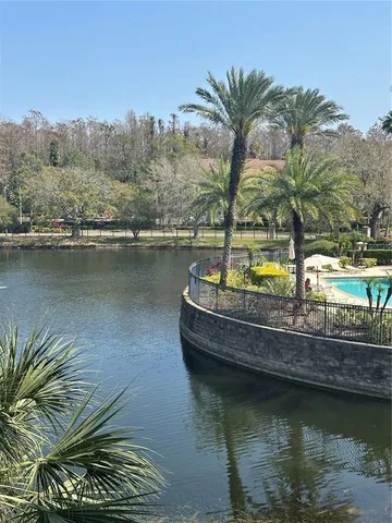 a view of a swimming pool and lounge chair