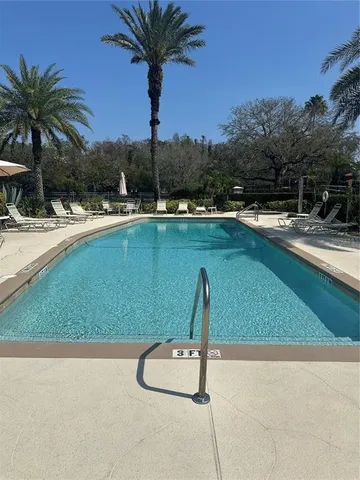 a view of swimming pool with a yard