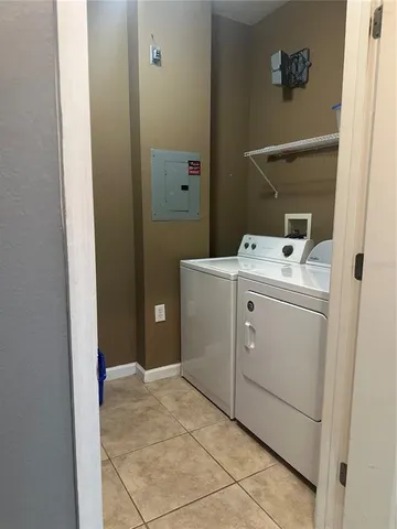 a kitchen with granite countertop a stove and a refrigerator