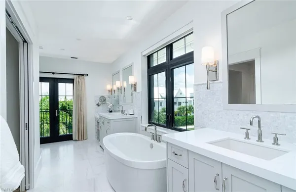 a bedroom with a bed and a mirror