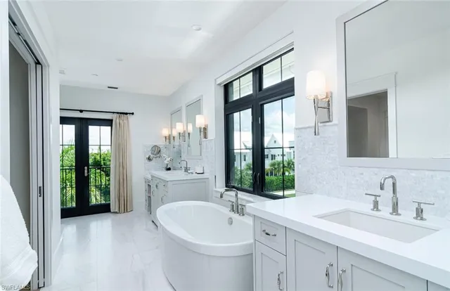 a bedroom with a bed and a mirror