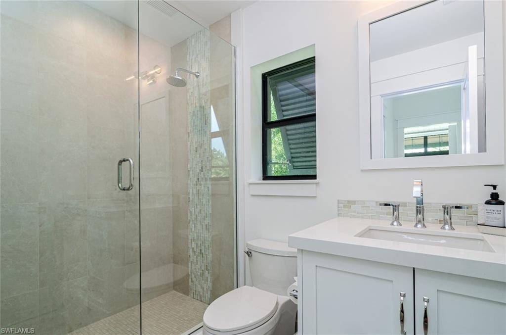 930 9th Street South, Unit 930 Naples, FL 34102 - Photo 17 of 17 a bathroom with a sink toilet and shower