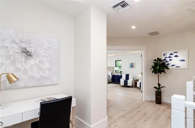 a bathroom with a double vanity sink toilet mirror and bathtub