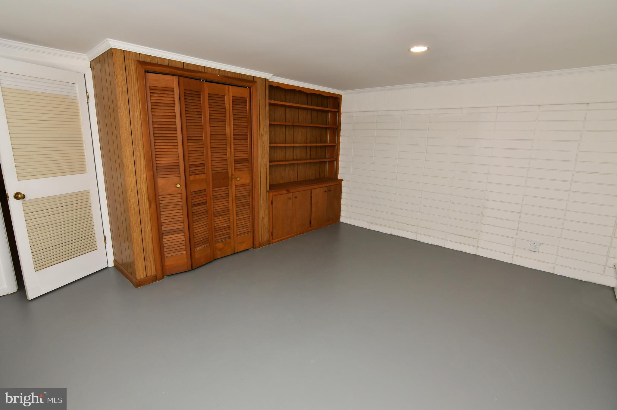 437 Beechcroft Road Winchester, VA 22601 - Photo 38 of 52 a view of an empty room with a wooden door
