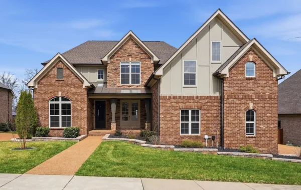 front view of a house with a yard