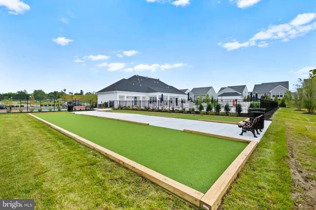 a view of outdoor space with swimming pool and green space