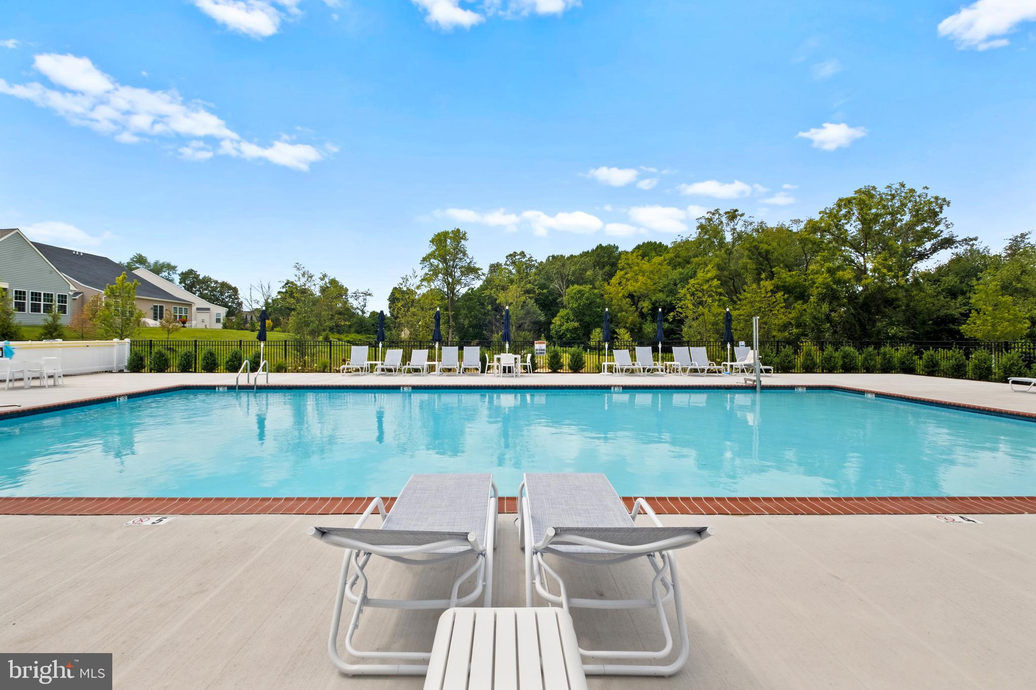 0 Messina Loop Loop Mullica Hill, NJ 08062 - Photo 20 of 35 a view of a lake with couches chairs
