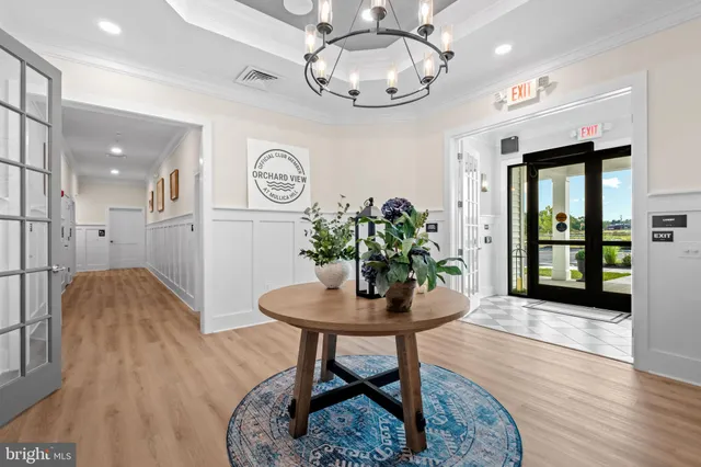 a workspace room with furniture and wooden floor