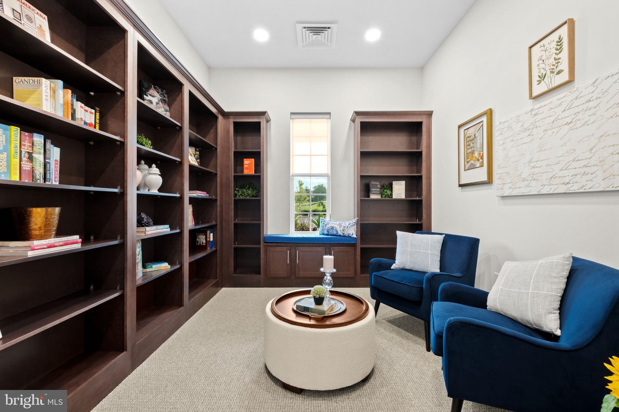 0 Messina Loop Loop Mullica Hill, NJ 08062 - Photo 23 of 35 a living room with furniture and a book shelf