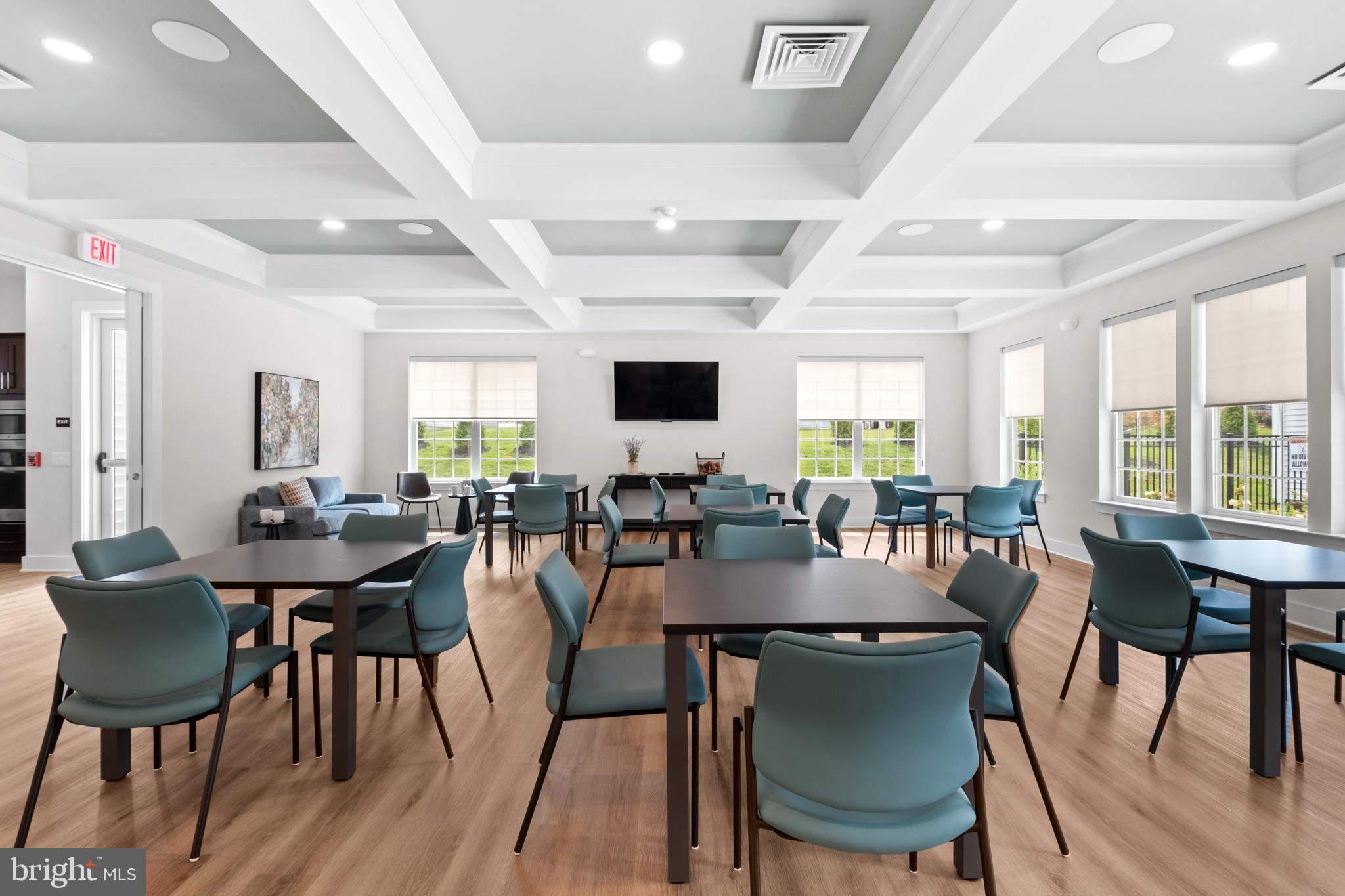 0 Messina Loop Loop Mullica Hill, NJ 08062 - Photo 34 of 35 a view of a dining room with furniture and wooden floor