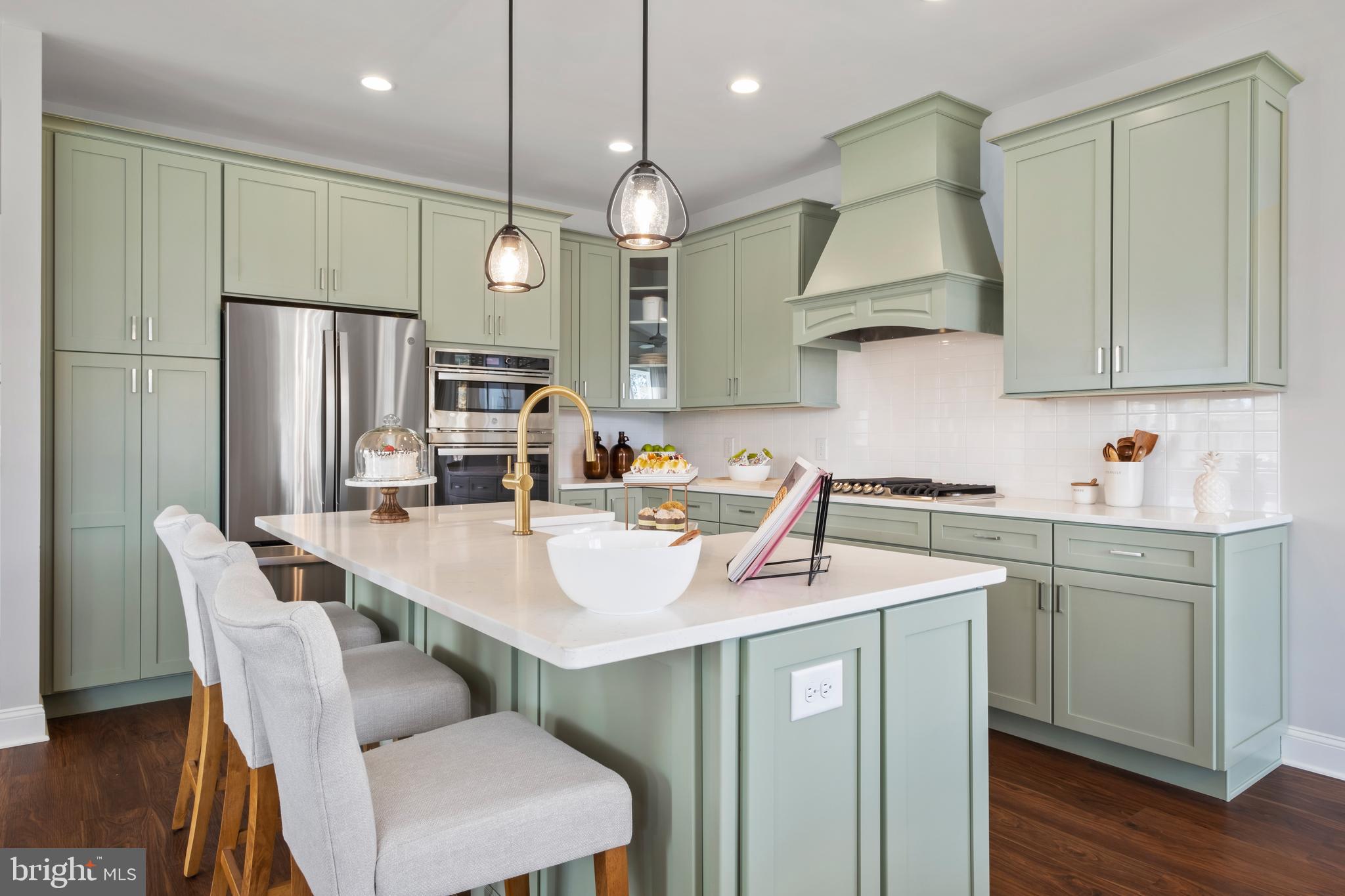 0 Messina Loop Loop Mullica Hill, NJ 08062 - Photo 4 of 35 a kitchen with a sink a refrigerator and chairs