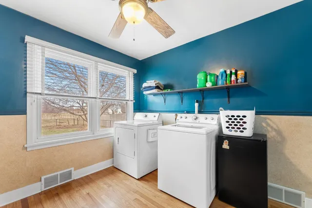 a view of cabinets and wooden floor