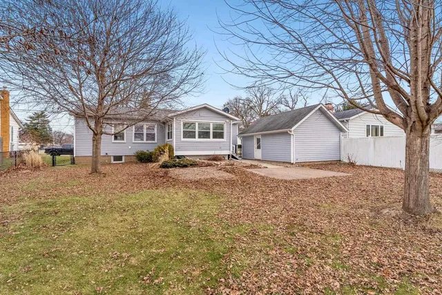 a house that has a tree in front of it