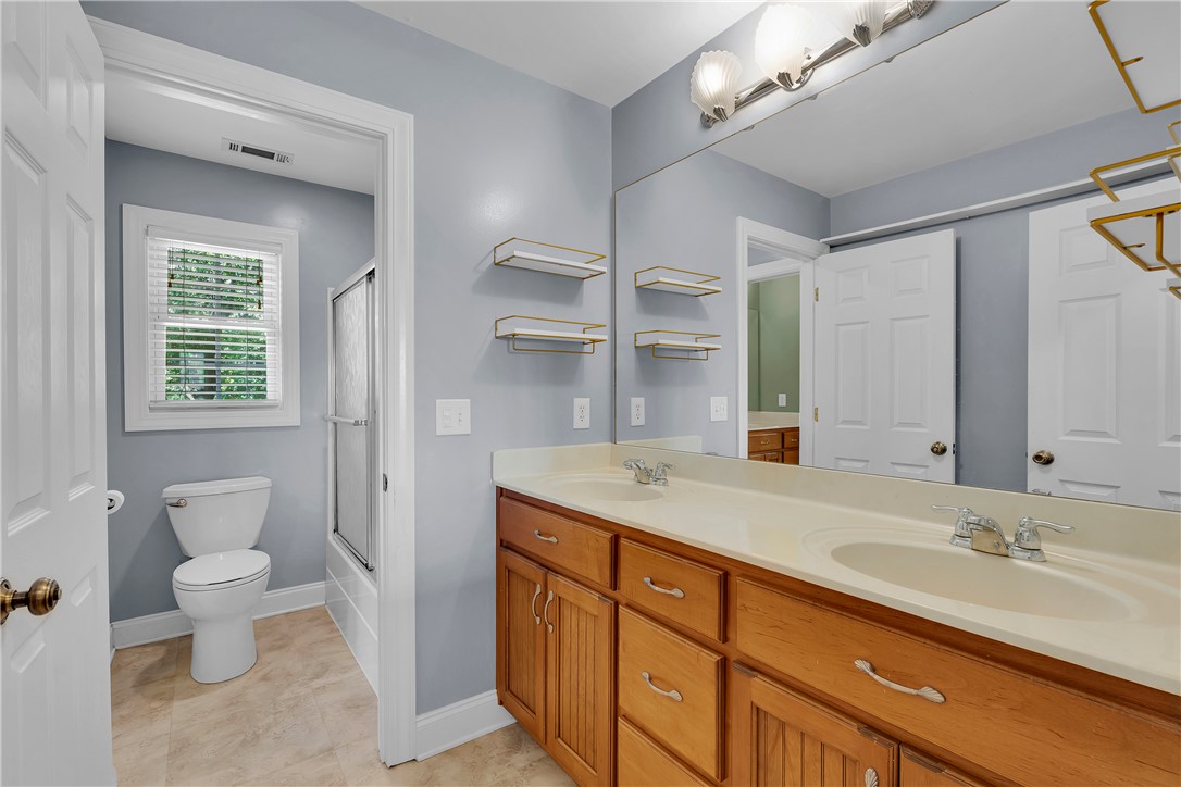 406 Hopewell Ridge Anderson, SC 29621 - Photo 30 of 46 This bright bathroom features a spacious dual vanity, offering ample counter space and storage.