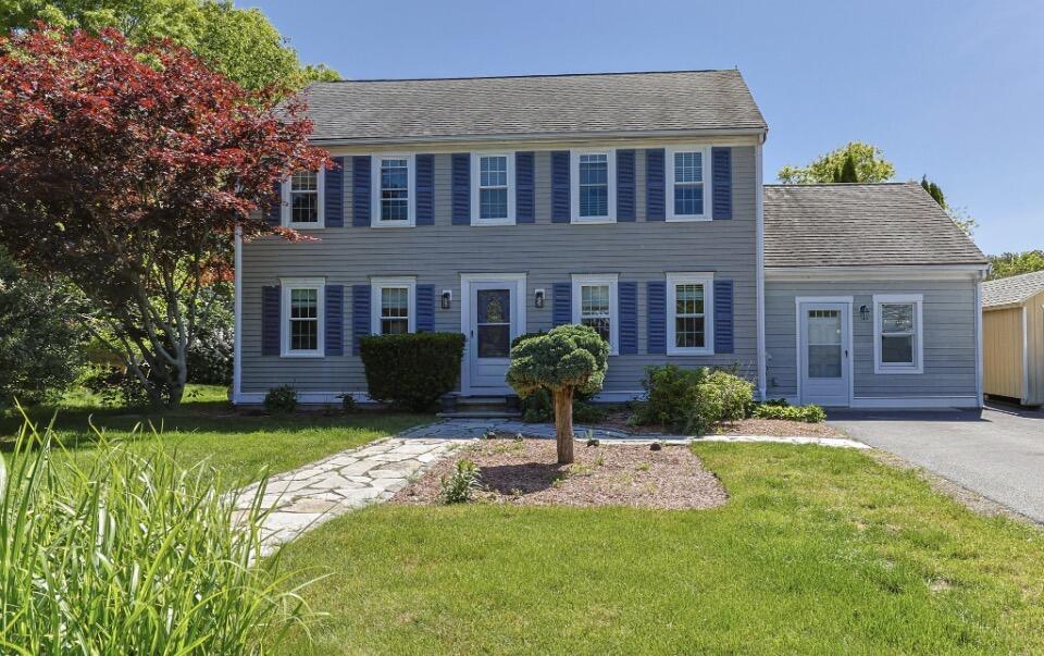 30 Sheffield Place Mashpee, MA 02649 - Photo 3 of 38 a front view of a house with a yard and porch