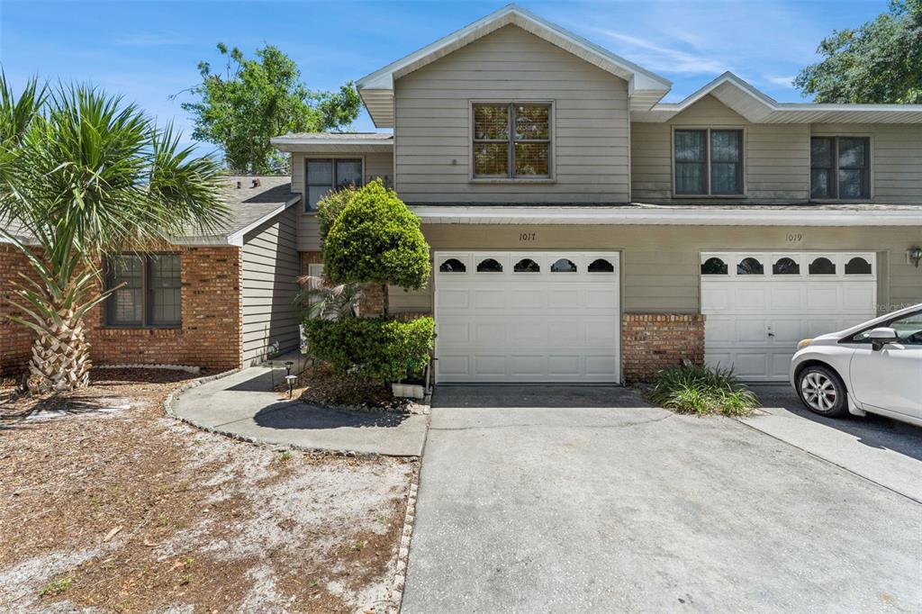 1017 Monroe Avenue St. Cloud, FL 34769 - Photo 1 of 53 a view of a house with a yard and large parking space