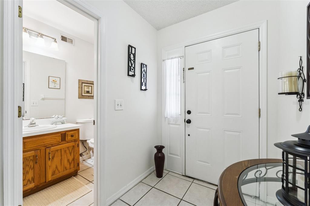 1017 Monroe Avenue St. Cloud, FL 34769 - Photo 15 of 53 a bathroom with a sink and a mirror