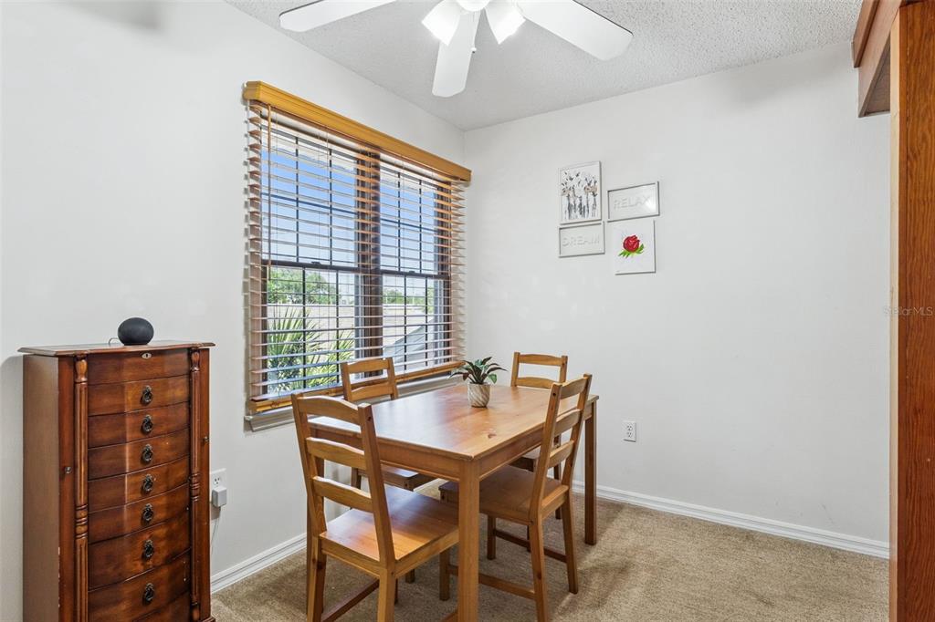 1017 Monroe Avenue St. Cloud, FL 34769 - Photo 19 of 53 a dining room with furniture and window