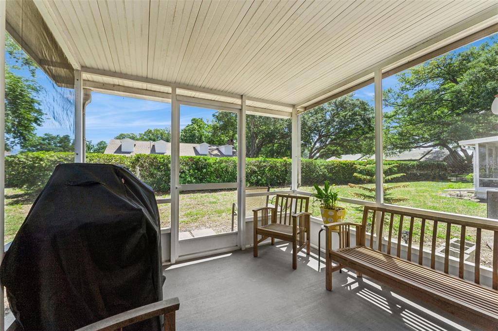 1017 Monroe Avenue St. Cloud, FL 34769 - Photo 2 of 53 a view of a two chairs in the porch next to a yard