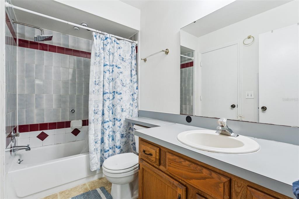 1017 Monroe Avenue St. Cloud, FL 34769 - Photo 23 of 53 a bathroom with a sink toilet and shower