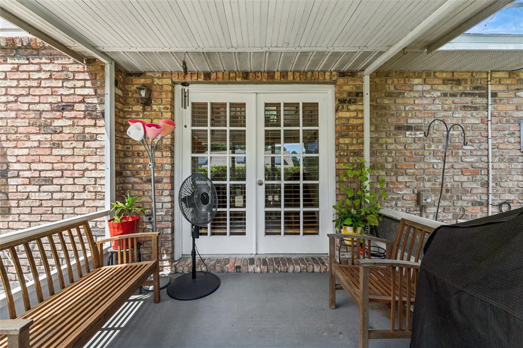 1017 Monroe Avenue St. Cloud, FL 34769 - Photo 26 of 53 a balcony with table and chairs