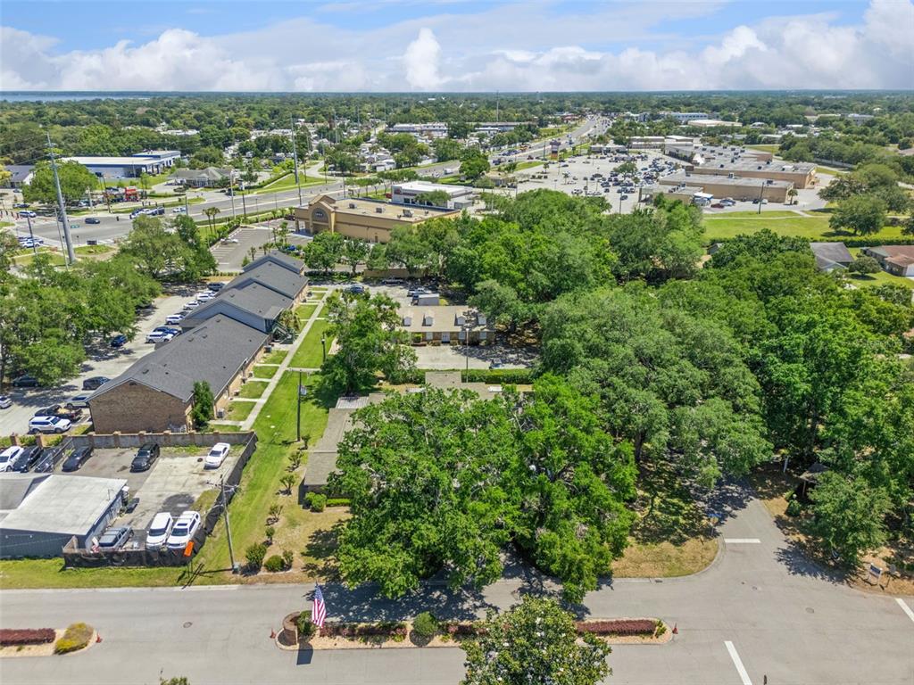 1017 Monroe Avenue St. Cloud, FL 34769 - Photo 50 of 53 an aerial view of residential houses with outdoor space and trees