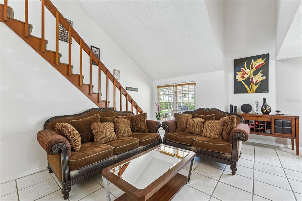 1017 Monroe Avenue St. Cloud, FL 34769 - Photo 5 of 53 a living room with furniture and a couch