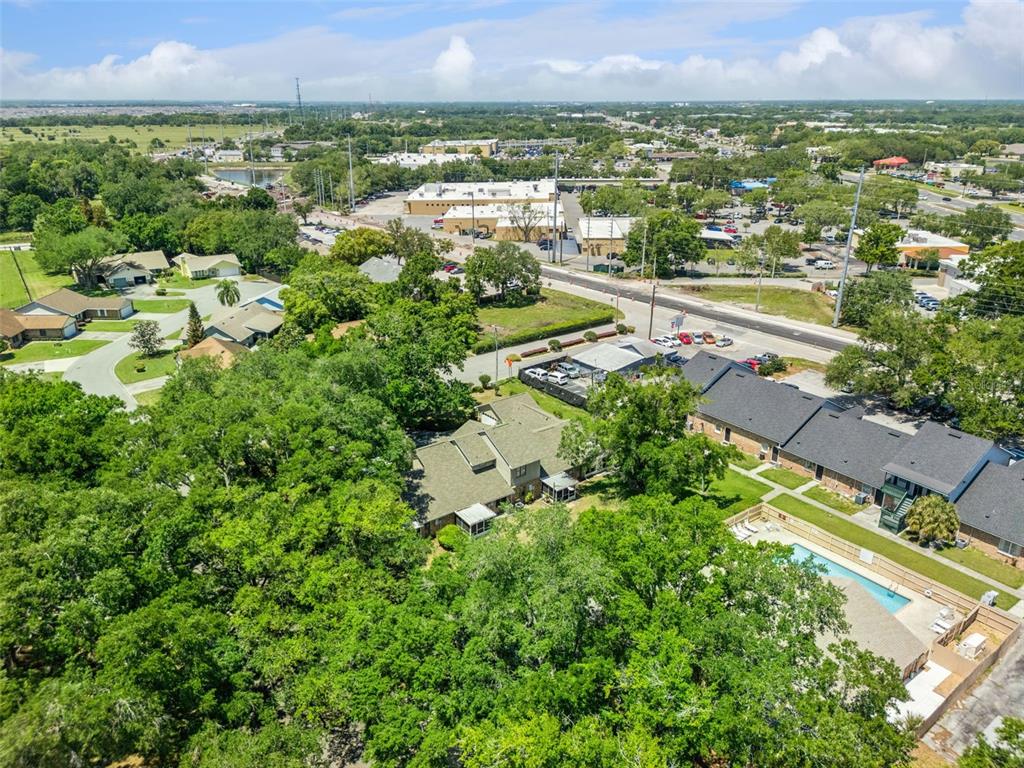 1017 Monroe Avenue St. Cloud, FL 34769 - Photo 51 of 53 an aerial view of residential houses with outdoor space and trees