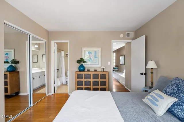 a spacious bedroom with a bed and a couch