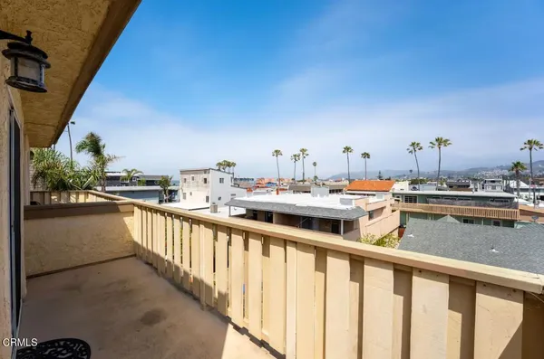 a view of a balcony with chairs