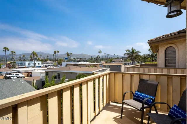 a view of a balcony with chairs