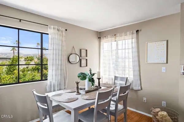 a view of a dining room with furniture window and outside view