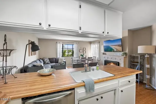 a view of living room with furniture and a fireplace