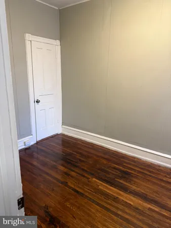 a view of room with wooden floor