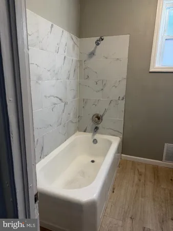 a bathroom with a white bath tub