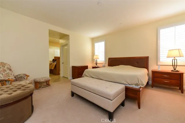 a bedroom with a bed and a couch