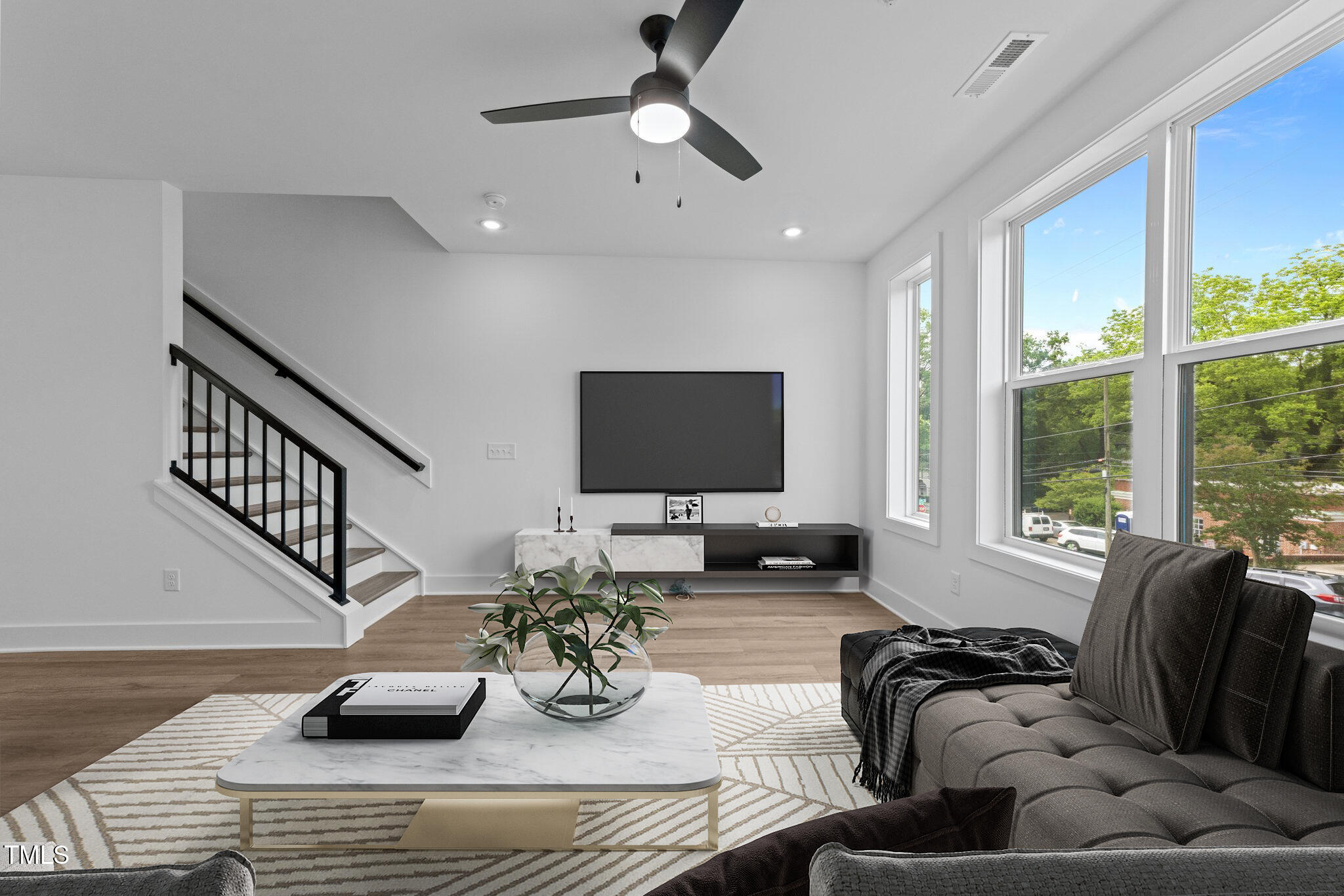 710 West North Street, Unit 102 Raleigh, NC 27603 - Photo 13 of 37 a living room with furniture and a flat screen tv
