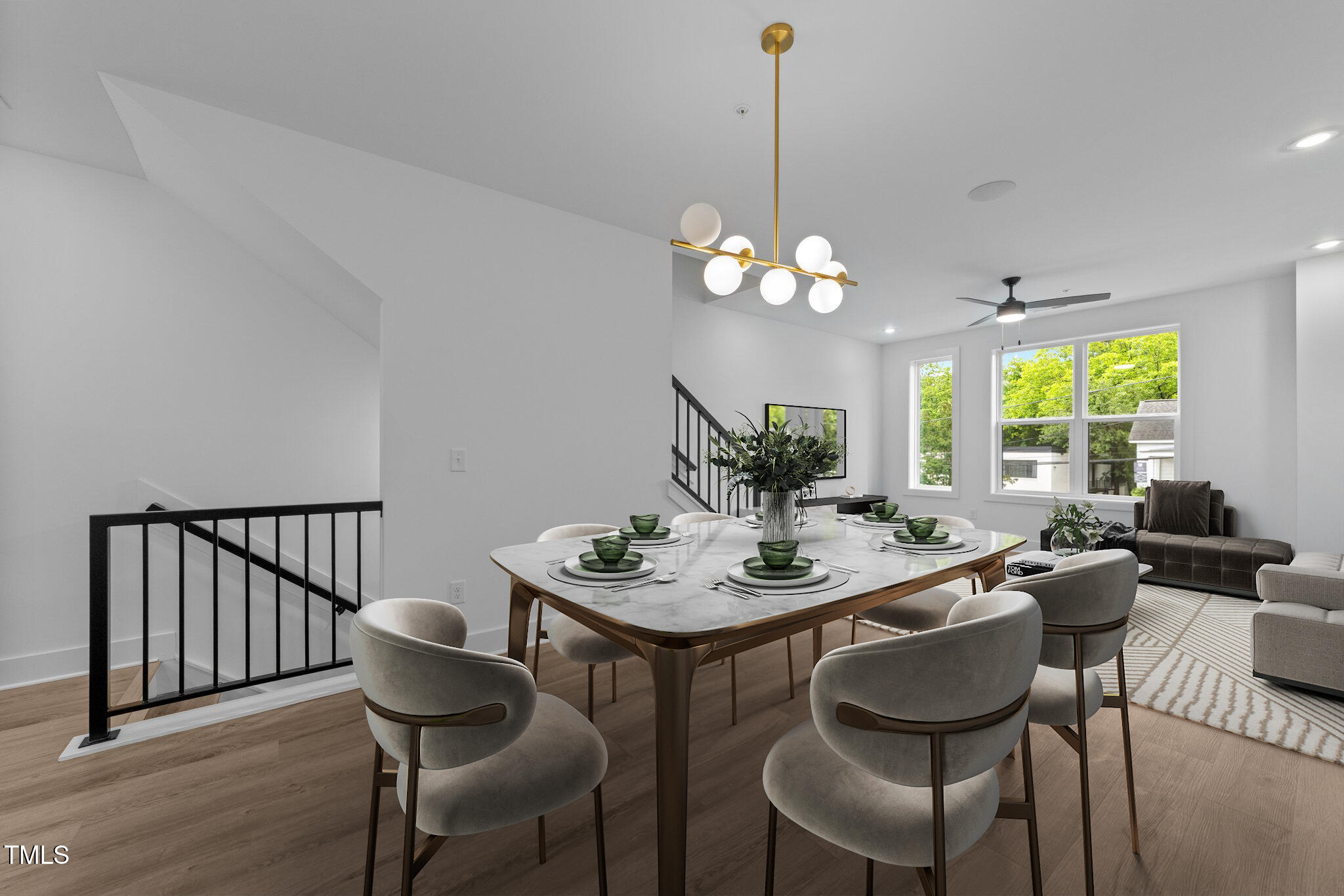 710 West North Street, Unit 102 Raleigh, NC 27603 - Photo 14 of 37 a view of a dining room with furniture a chandelier and wooden floor