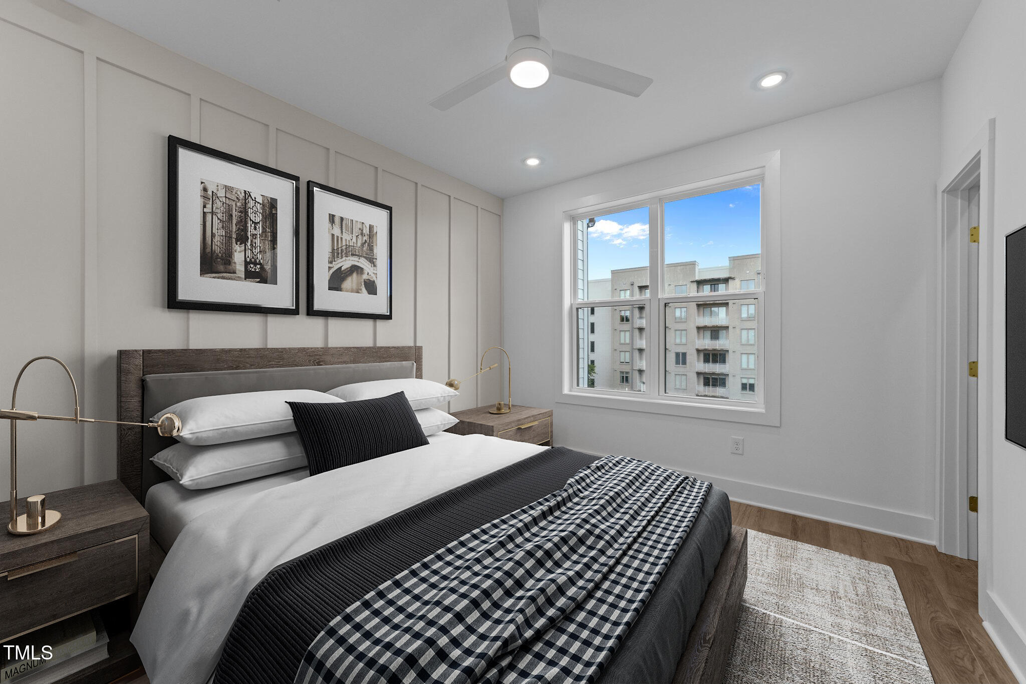 710 West North Street, Unit 102 Raleigh, NC 27603 - Photo 23 of 37 a bedroom with bed and a window