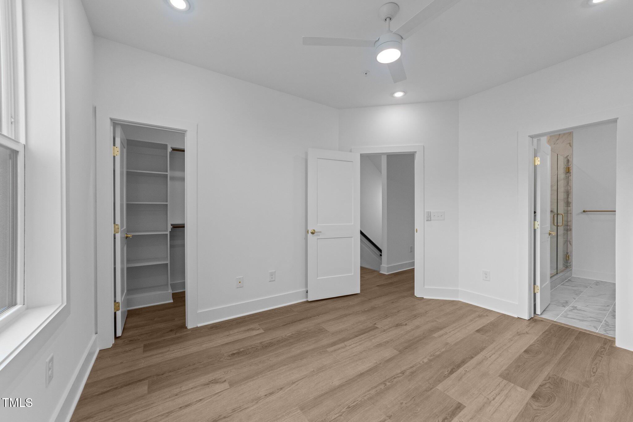 710 West North Street, Unit 102 Raleigh, NC 27603 - Photo 24 of 37 a view of an empty room with wooden floor